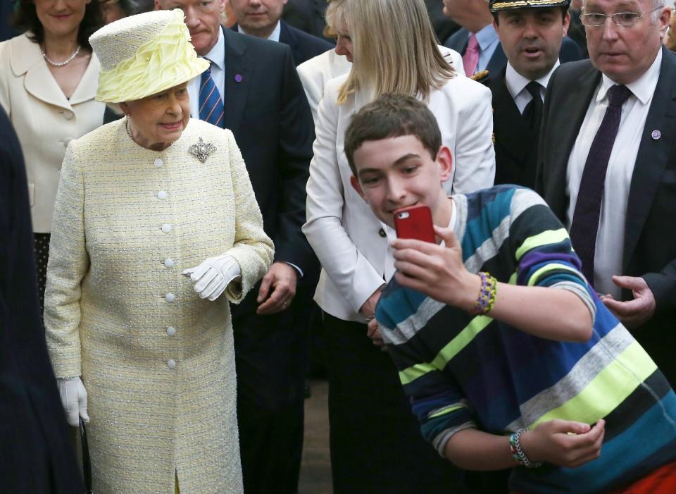 <p>Selfies are seen as a <a href="https://www.news24.com/channel/Gossip/Royal-News/prince-william-breaks-royal-protocol-to-take-a-selfie-with-a-fan-20200305" rel="nofollow noopener" target="_blank" data-ylk="slk:breach in royal protocol;elm:context_link;itc:0;sec:content-canvas" class="link ">breach in royal protocol</a>, but that doesn't stop fans from taking them. Queen Elizabeth graciously joined the bandwagon of the digital trend, as she greets her fans in 2014.</p>