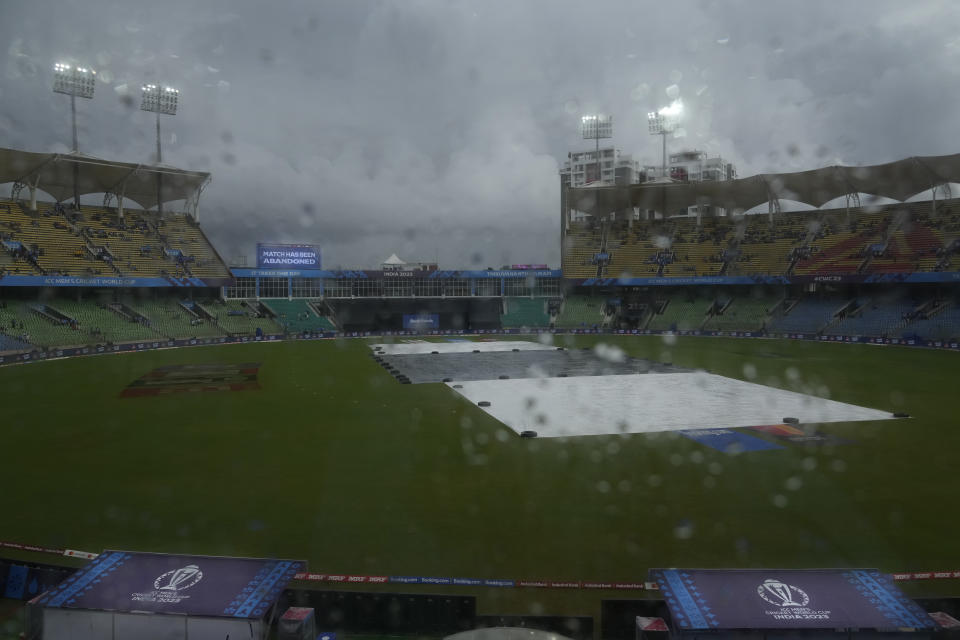 An electronic sign board reads ICC Men's Cricket World Cup warm up match between India and Netherlands stands abandoned due to continues rains in Thiruvananthapuram, India, Tuesday, Oct. 3, 2023. (AP Photo/Manish Swarup)