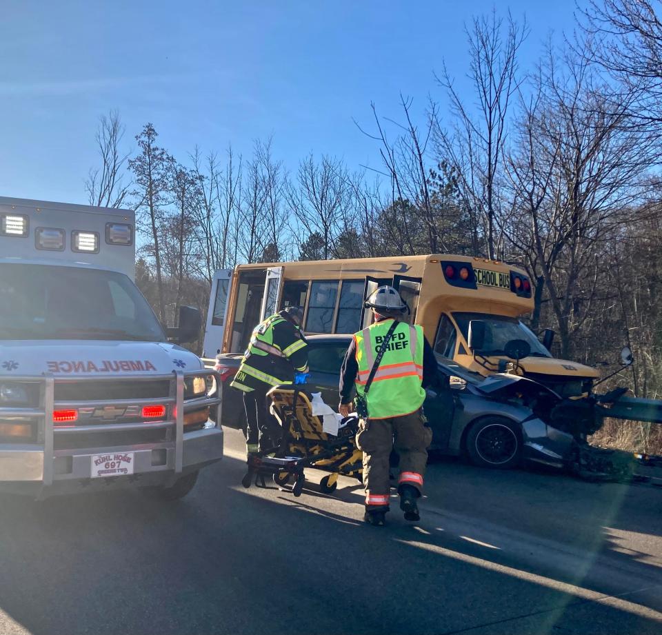 Belle Valley and Kuhl Hose Company volunteers prepare patients for transport following a three-vehicle crash on Route 97 in Millcreek Township on Feb. 13.