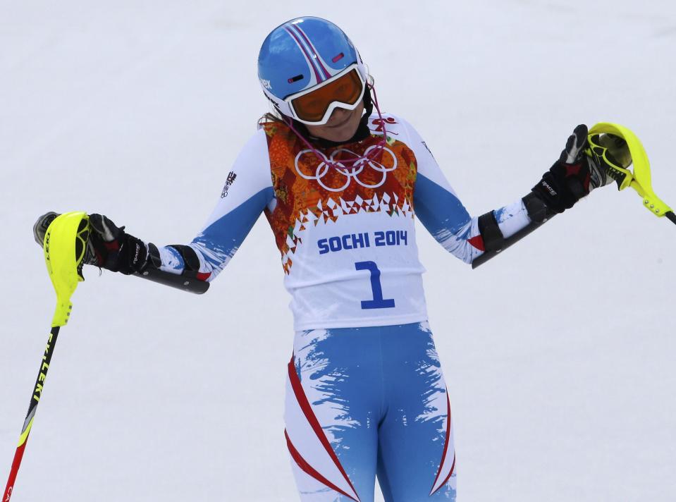 Austria's Schild reacts in the finish area after competing in the first run of the women's alpine skiing slalom event during the 2014 Sochi Winter Olympics at the Rosa Khutor Alpine Center