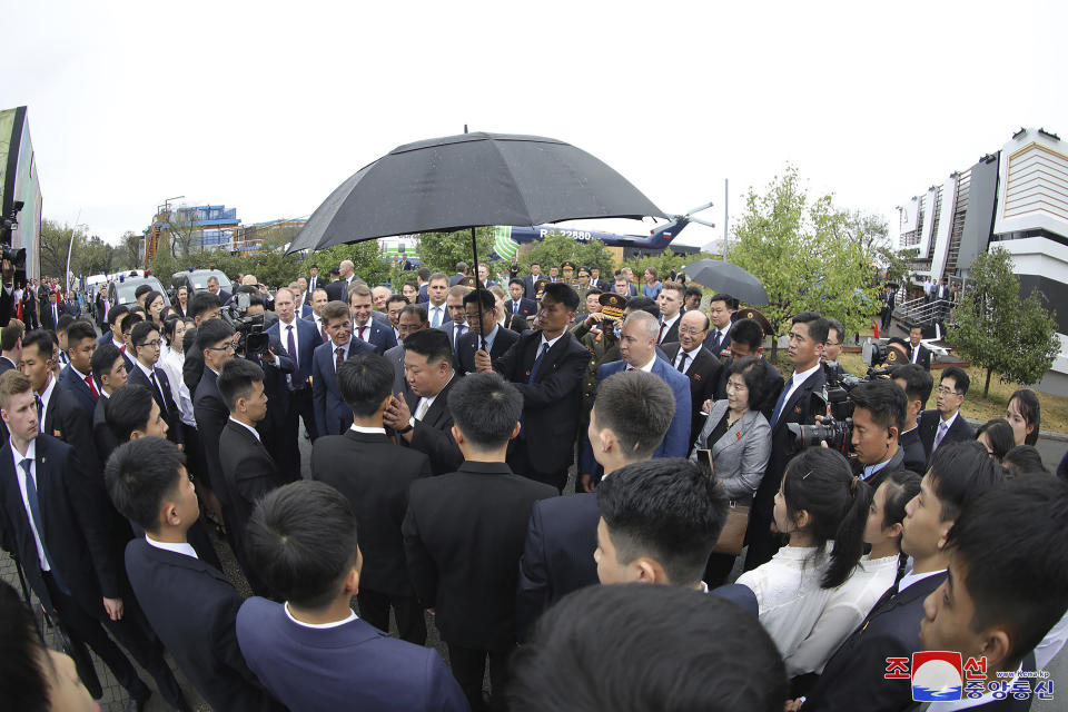 In this photo provided by the North Korean government, North Korea leader Kim Jong Un, center, meets North Korean students at the Far Eastern Federal University in Russky Island, Vladivostok, Russian Far East Sunday, Sept. 17, 2023. Independent journalists were not given access to cover the event depicted in this image distributed by the North Korean government. The content of this image is as provided and cannot be independently verified. Korean language watermark on image as provided by source reads: "KCNA" which is the abbreviation for Korean Central News Agency. (Korean Central News Agency/Korea News Service via AP)