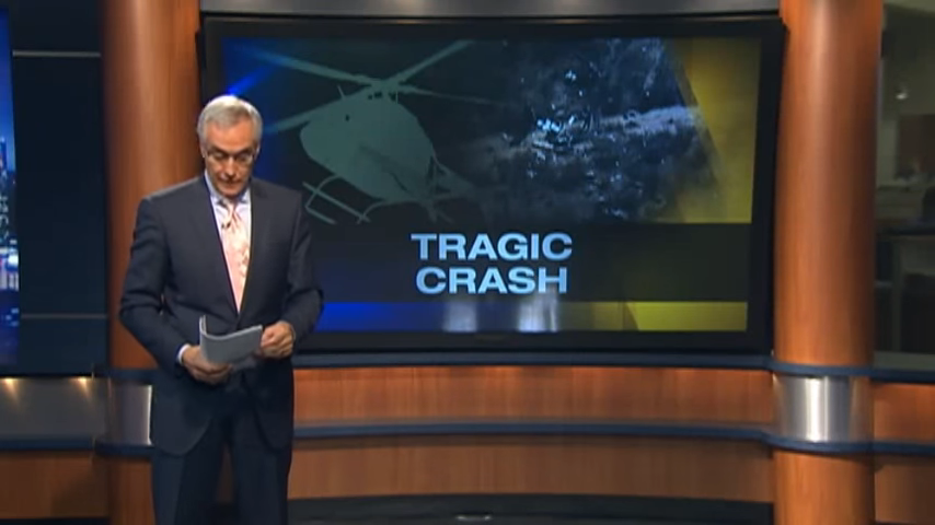 A news reporter reporting on a "tragic crash"