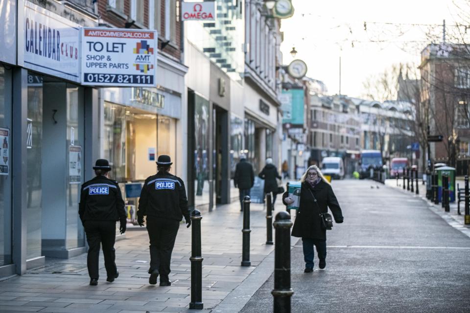 Two police officers patrol an empty High Street in Worcester city centre, Worcestershire, on the first day of the third national lockdown in England, to reduce the spread of COVID-19. Prime Minister Boris Johnson announced further coronavirus restrictions during a televised address to the nation last night.