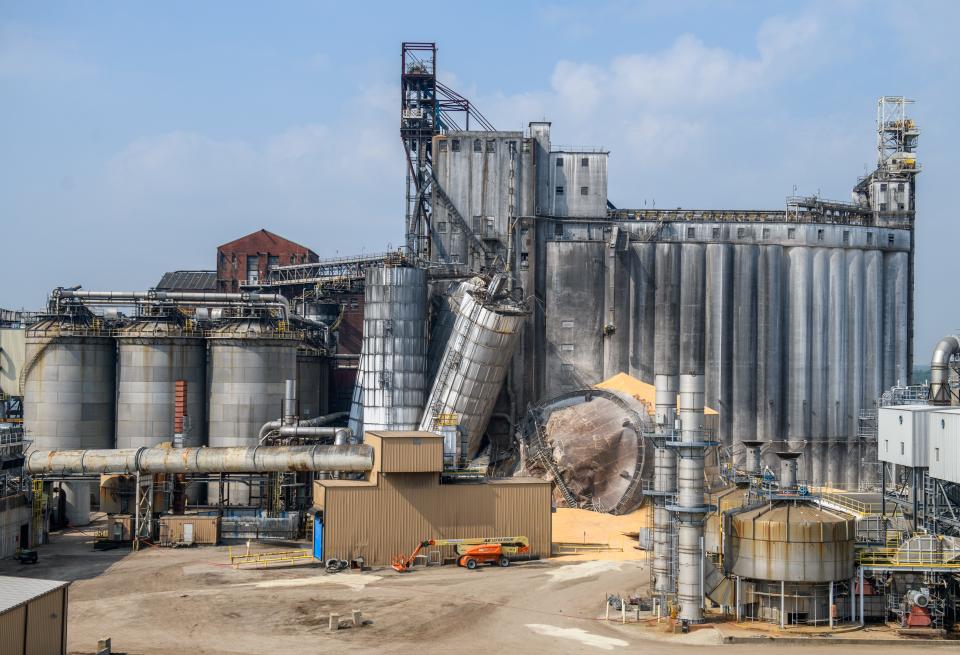 Grain silos lean precariously at the BioUrja ethanol plant Thursday, May 11, 2022, on Southwest Washington Street after an explosion Wednesday night that left two people injured.