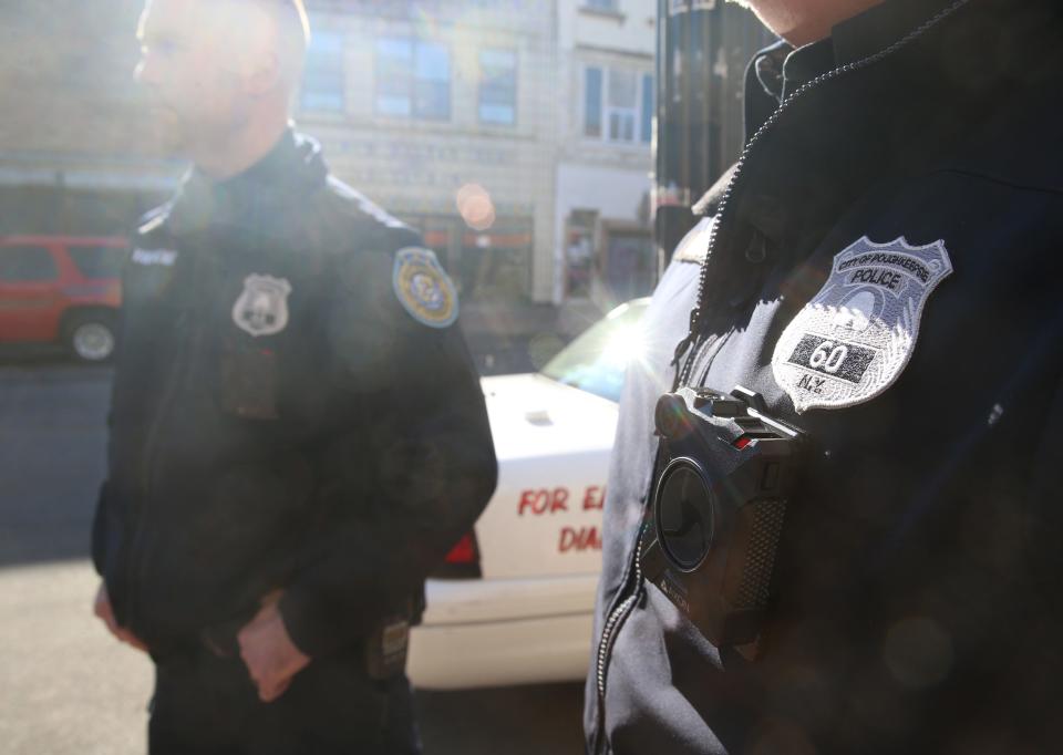 City of Poughkeepsie Police officers, from left, Kevin Van Wagner and Mike Braren wear a body cameras while patrolling Main Street on February 03, 2020.