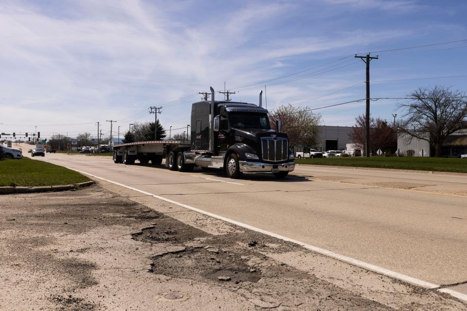 An 18-wheeler drives near the intersection of Alpine Road and Mayflower Avenue on April 9, 2024, in Rockford.