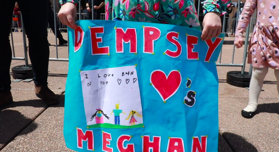 She held up this sign for hours as she waited for Harry and Meghan to make an appearance. Photo: Yahoo Lifestyle