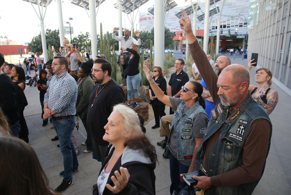 <p>Mourners react during a vigil at Las Vegas City Hall for victims of the mass shooting in Las Vegas, Nevada, USA, 02 October 2017. (Photo: Eugene Garcia/EPA-EFE/REX/Shutterstock) </p>