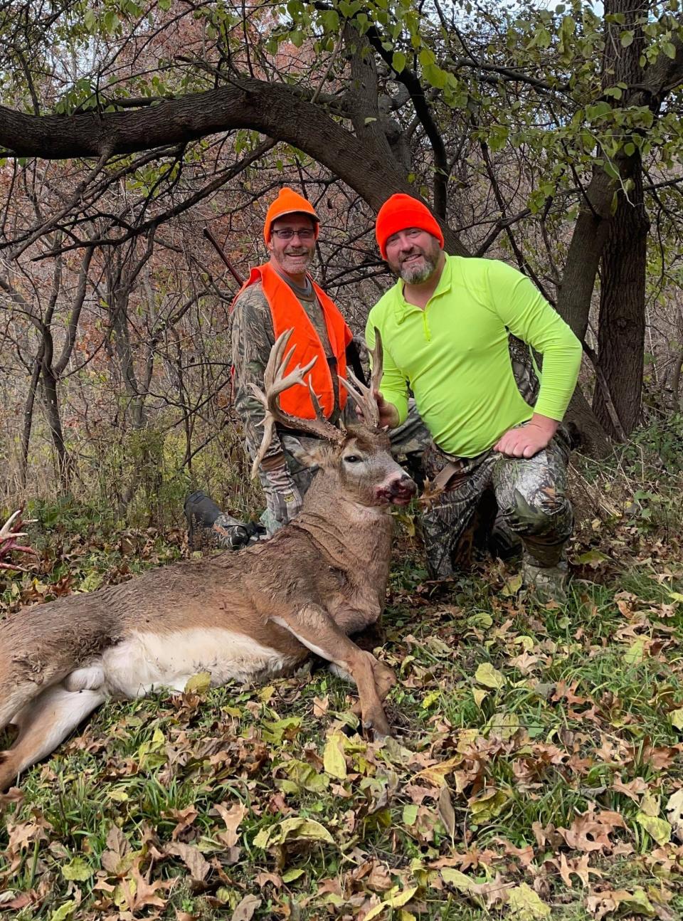 Justin Gilmore's uncle, Steve Peed, poses with Gilmore's 22-point buck he harvested opening day of the firearms portion of deer season in Ray County.