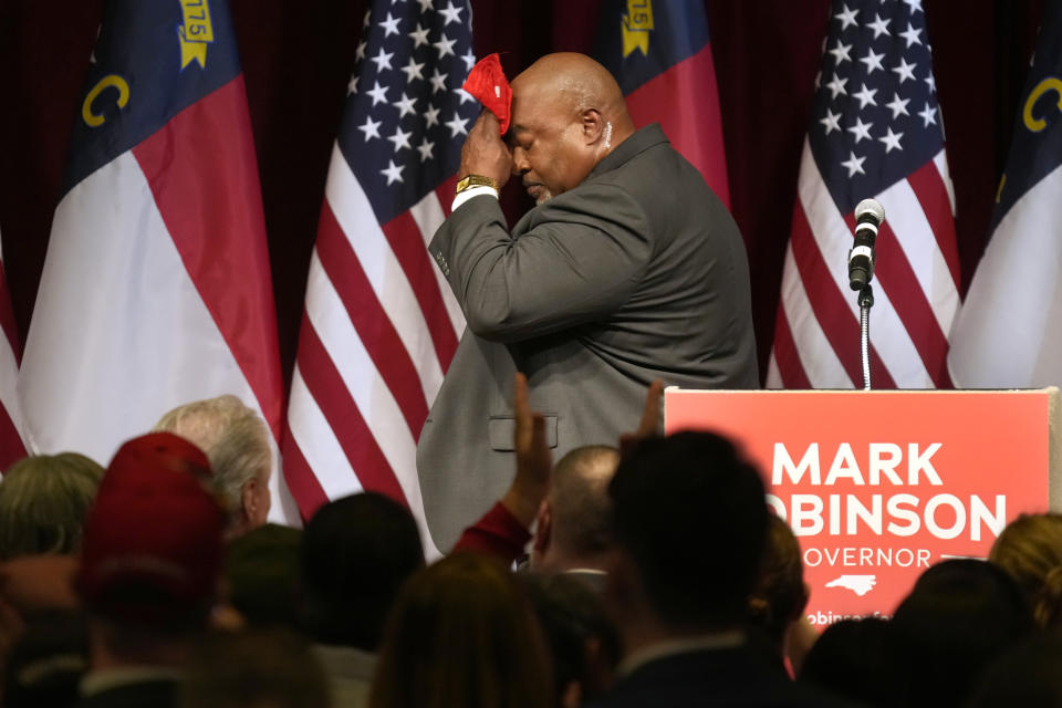 North Carolina Lt. Gov. Mark Robinson wipes his face after speaking at an election night event in Greensboro, N.C., Tuesday, March 5, 2024. (AP Photo/Chuck Burton)