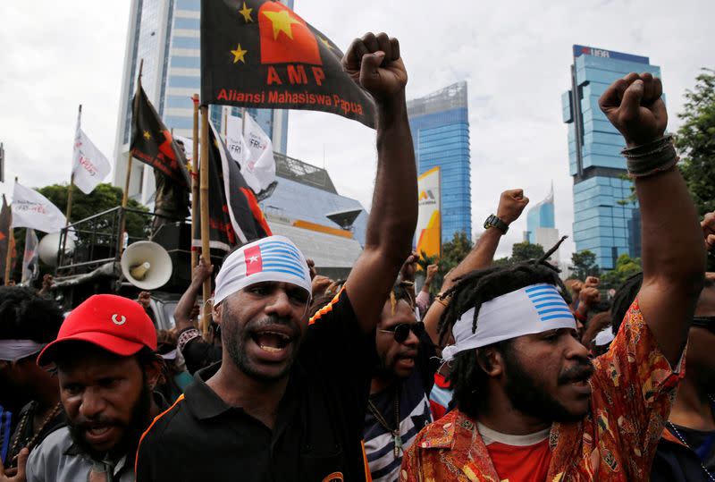 FILE PHOTO: Protesters shout slogans during a rally calling for their right to self-determination in the Indonesian controlled part of Papua, in Jakarta, Indonesia