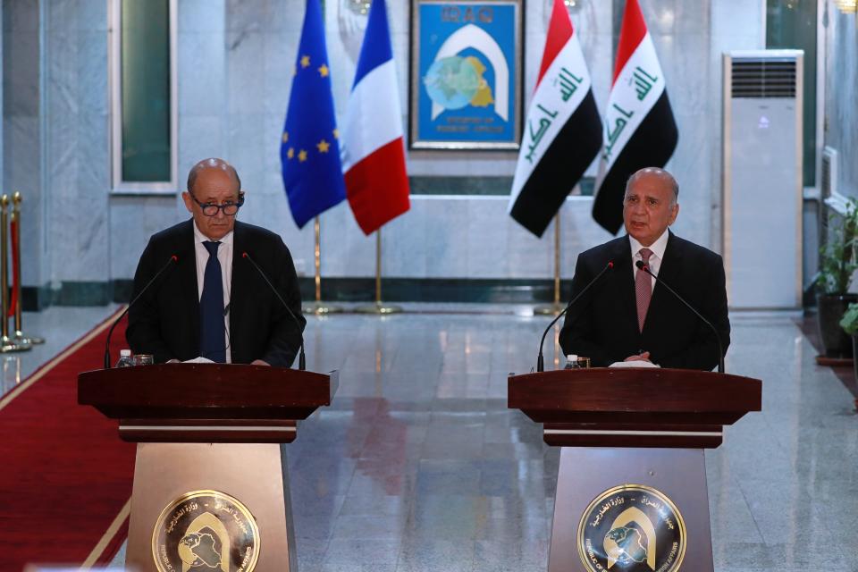 Iraqi Foreign Minister Fouad Hussein, right, and visiting French counterpart Jean-Yves Le Drian, hold a news conference following their meeting in Baghdad, Iraq, Thursday, July 16, 2020. (AP Photo/Hadi Mizban)
