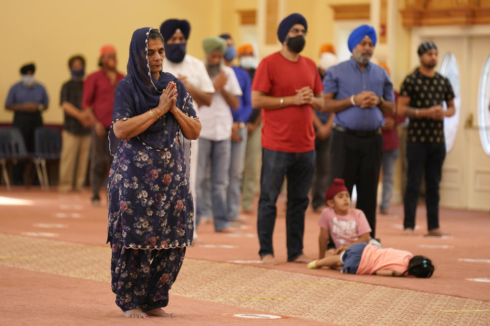 Sikhs participate in a worship service at a gurdwara in Glen Rock, N.J., Sunday, Aug. 15, 2021. (AP Photo/Seth Wenig)