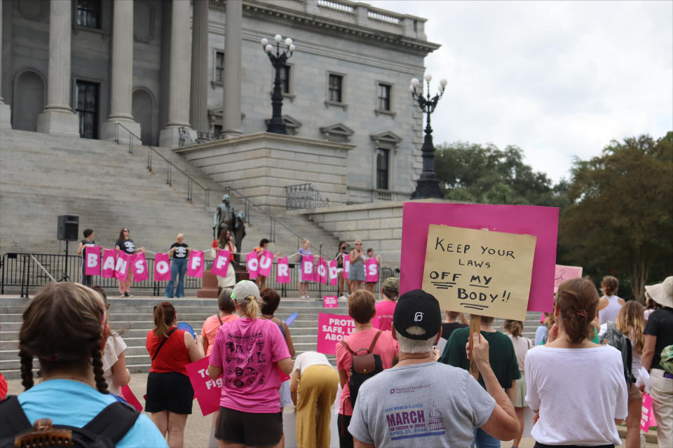 Protesters gather outside the state house in opposition to a proposed abortion ban, in Columbia, S.C. (James Pollard / AP file)