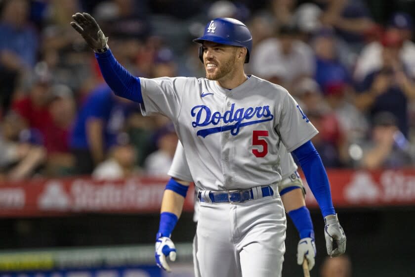 Los Angeles Dodgers' Freddie Freeman reacts to his friends and family in the stands.