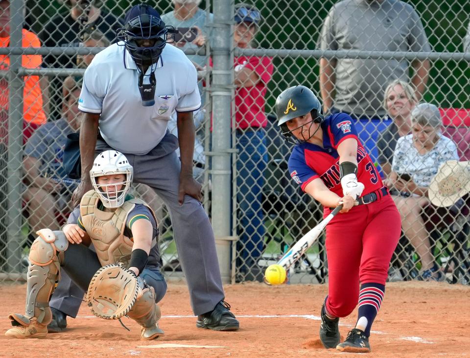 Taylor's Amya Ramos connects for a rbi single during during a game with DeLand at DeLand High School, Tuesday, April 2, 2024.