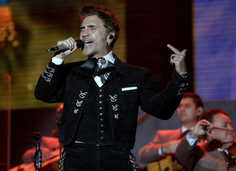 Alejandro Fernandez performs at the Besame Mucho 2023 event at Dodger Stadium on Saturday, Dec. 2, 2023.