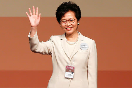 Carrie Lam waves after she won the election for Hong Kong's Chief Executive in Hong Kong, China March 26, 2017. REUTERS/Bobby Yip