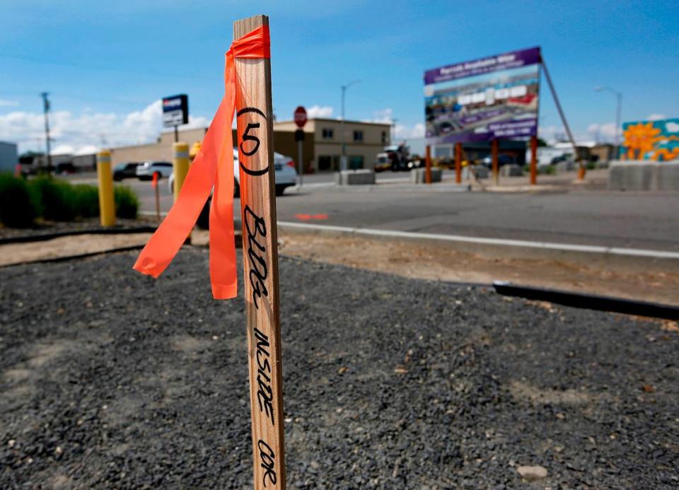 A wooden survey stick at the Kennewick site shows where a corner of the restaurant building will be.