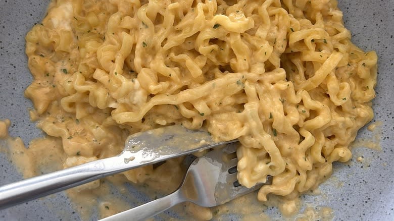 knife and fork in carbonara ramen