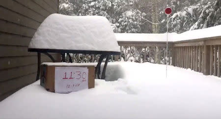 Snow hits a porch in Banner Elk, North Carolina, U.S., December 9, 2018 in this still image from a time-lapse video obtained from social media. Rod Wilbourn/via REUTERS