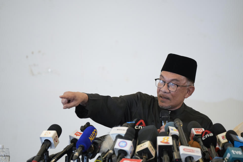 Malaysia's newly appointed Prime Minister Anwar Ibrahim delivers his speech during a gathering in Kuala Lumpur, Malaysia, Thursday, Nov. 24, 2022. Malaysia's king on Thursday named Anwar as the country's prime minister, ending days of uncertainty after the divisive general election produced a hung Parliament. (AP Photo/Vincent Thian)