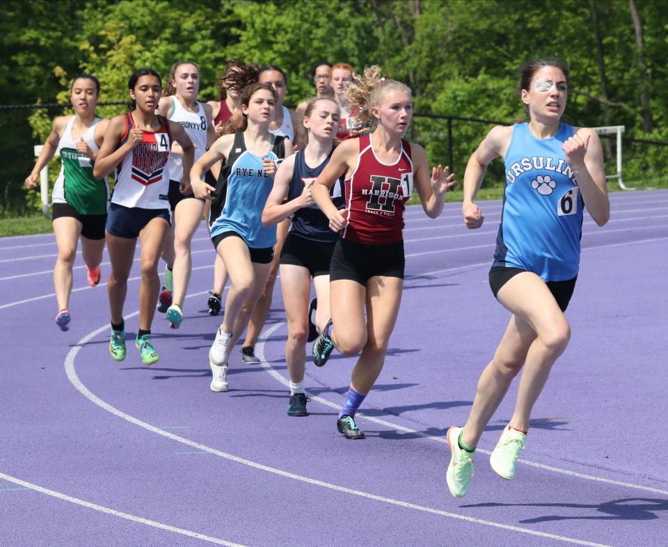 Daphne Banino from The Ursuline School leads the pack during the girls 800 meter run on day 2 of the Westchester County Track & Field Championships held at John Jay High School in Cross River, May 21, 2022. 