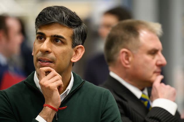 BRISTOL, ENGLAND - MARCH 14: UK Prime Minister Rishi Sunak (L) and Conservative MP for Filton and Bradley Stoke Jack Lopresti (R) listen to information on engine development during a visit to the Rolls-Royce manufacturing facility on March 14, 2024 in Bristol, England. The Prime Minister met with apprentices, was shown the Rolls-Royce Typhoon and naval engines before opening their new 'Future Works' facility. (Photo by Leon Neal/Getty Images)