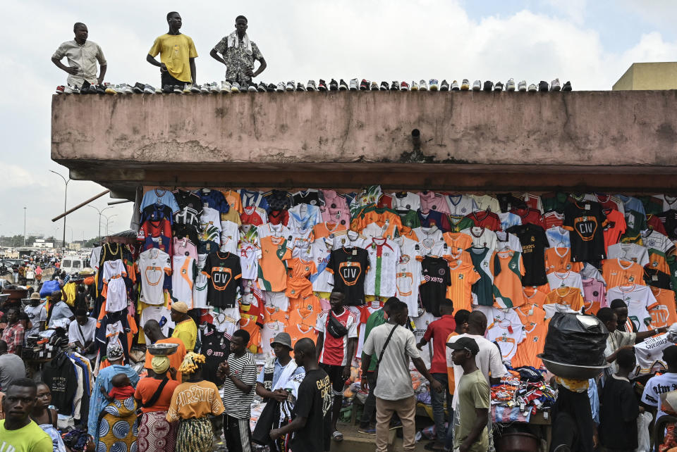 Vendors in the Ivory Coast sell kits of the participating nations. (Issouf Sanogo/AFP via Getty Images)