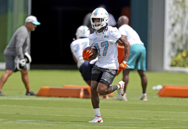 Miami Dolphins wide receiver Jaylen Waddle (17) runs a play during