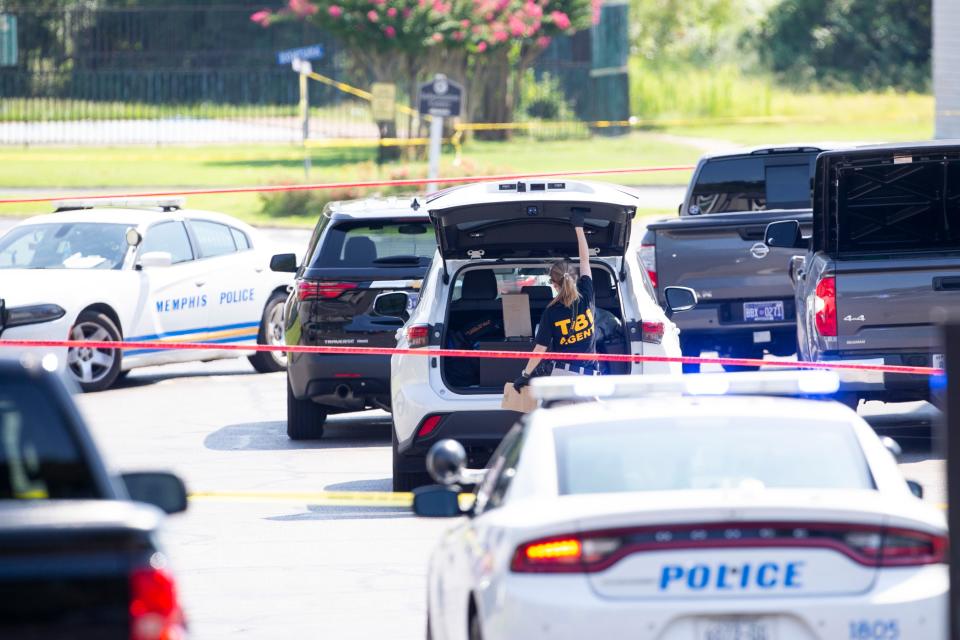 Tennessee Bureau of Investigation agents and Memphis Police Department officers investigate the scene of “a possible officer-involved shooting" after a man TBI identified as Eugene McNeal was found dead following a standoff with officers during a barricade situation in Raleigh on Sunday, August 20, 2023.