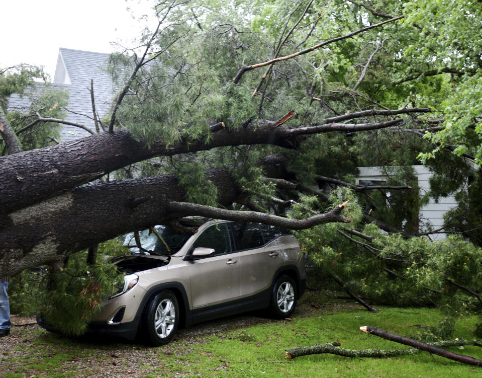 Storm damage is seen at a home on Main Street in Concord, Mich., on Wednesday, June 10, 2020. Strong storms with heavy winds swept across Jackson County causing power outages, downing trees and damaging property. (J. Scott Park/Jackson Citizen Patriot via AP)