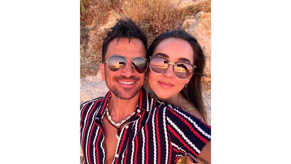 Peter and Emily Andre posing in a holiday selfie 