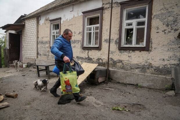 A resident of Vovchansk gets ready on Monday to leave the town and head to Kharkiv city, in the wake of Russian attacks.