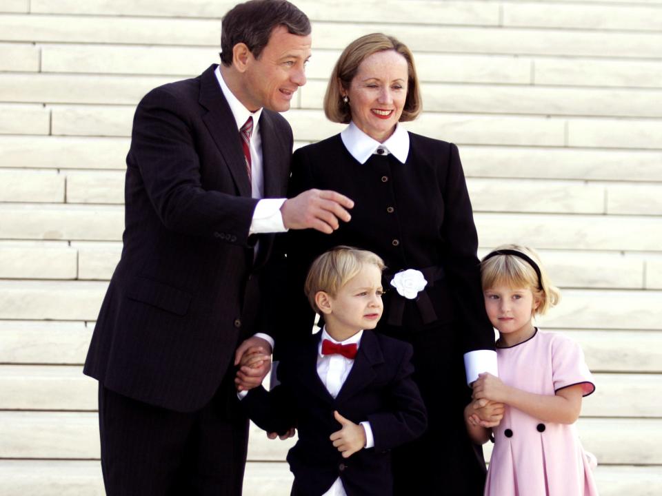 Supreme Court Chief Justice John Roberts, left, stands in front of the U.S. Supreme Court with his wife Jane, daughter Josie, 5, right, and son Jack,4, Monday, Oct 3, 2005, in Washington.