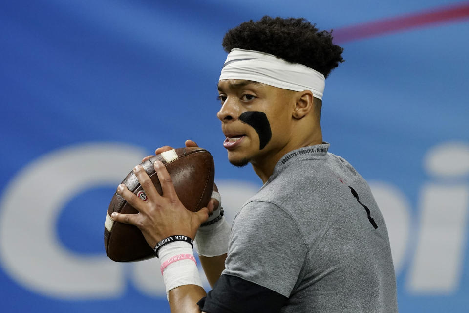 Ohio State quarterback Justin Fields warms up before the Sugar Bowl NCAA college football game against Clemson Friday, Jan. 1, 2021, in New Orleans. (AP Photo/John Bazemore)