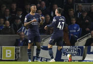 Manchester City's Phil Foden, right, celebrates with teammate Gabriel Jesus after scoring their side's third goal of the game during the English Premier League soccer match between Brighton and Hove and Manchester City at the AMEX Stadium, Brighton, London, Saturday, Oct. 23, 2021. (Gareth Fuller/PA via AP)