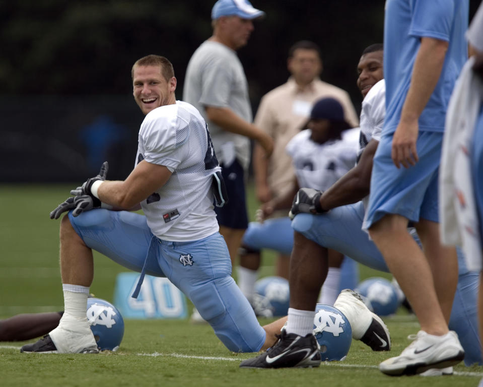 North Carolina linebacker Chase Rice smiles as he goes through stretching exercises with his teammates during practice in Chapel Hill, N.C., on Thursday Aug. 7, 2008. Chase Rice had his sights set on the NFL. Then the linebacker who tore up the ACC in 2006 tore up his left ankle in the season opener as a junior. It worked out pretty well for Rice in another area of entertainment. His current hit is a pairing with Florida Georgia Line: “Drinkin’ Beer. Talkin’ God. Amen.” (Robert Willett/The News & Observer via AP)