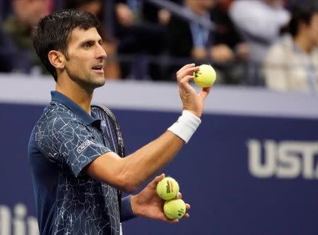 Sept 9, 2018; New York, NY, USA; Novak Djokovic of Serbia has an issue with the game balls during play with Juan Martin del Potro of Argentina in the men’s final on day fourteen of the 2018 U.S. Open tennis tournament at USTA Billie Jean King National Tennis Center. Mandatory Credit: Robert Deutsch-USA TODAY Sports