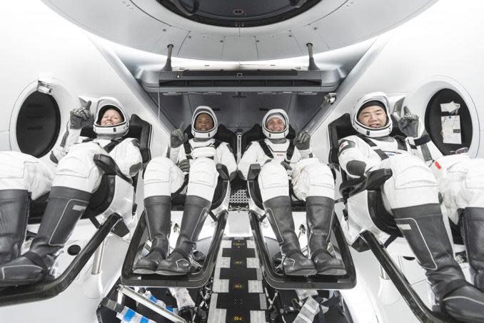 The Crew 1 astronauts strapped into a SpaceX Crew Dragon vehicle. Left to right: NASA astronauts Shannon Walker, pilot Victor Glover, commander Michael Hopkins and Japanese astronaut Soichi Noguchi. / Credit: NASA