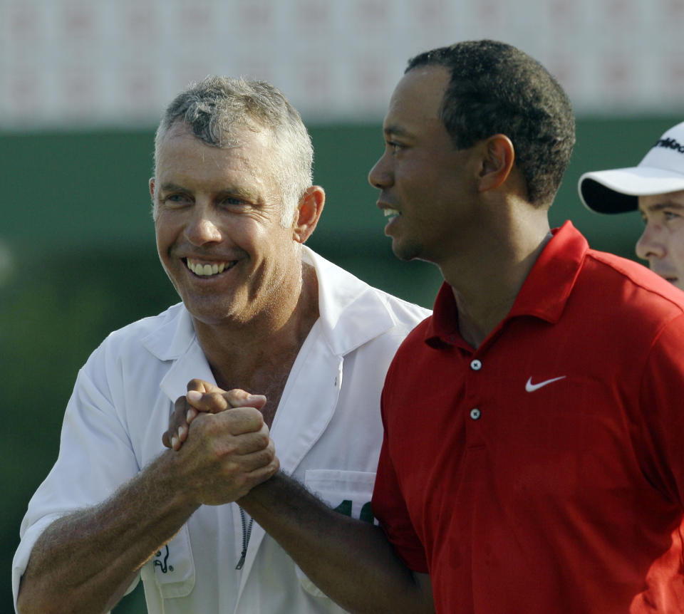 <p>Tiger Woods is congratulated by caddie Steve Williams after his the final round of the Masters golf tournament Sunday, April 10, 2011, in Augusta, Ga. (AP Photo/David J. Phillip) </p>