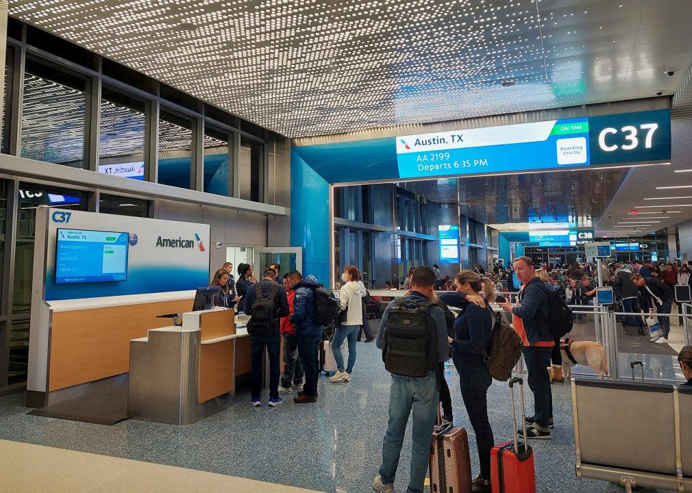 Passengers prepare to board a flight at Dallas Fort Worth International Airport.