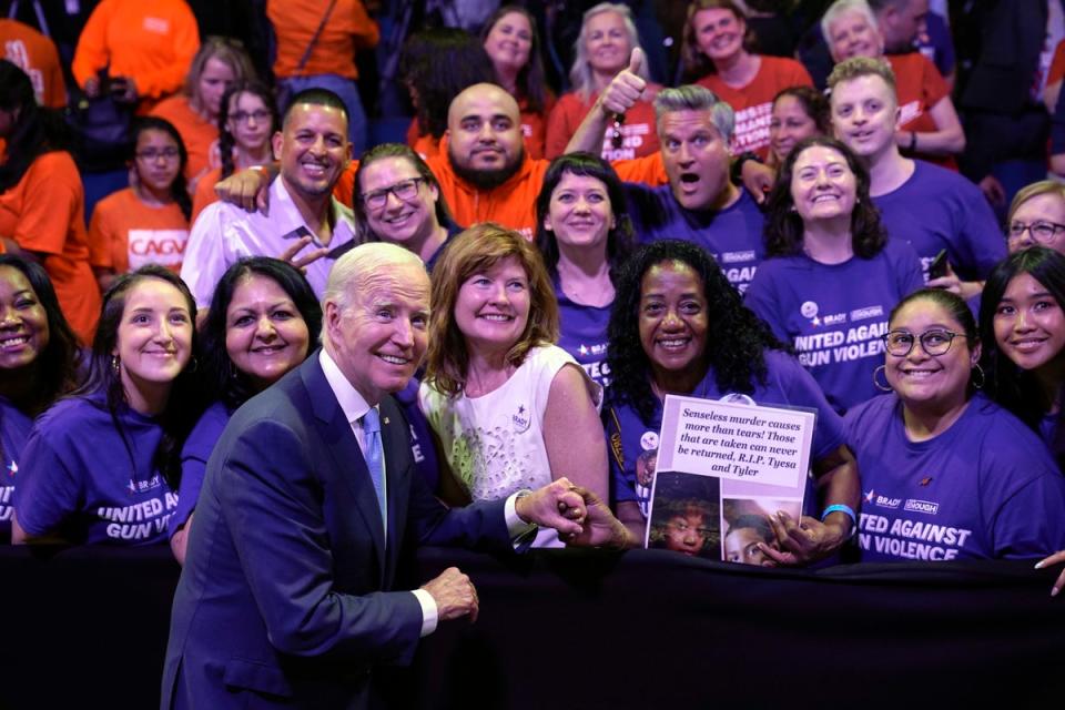 President Joe Biden poses for a photo with people in the audience after speaking at the National Safer Communities Summit at the University of Hartford in West Hartford, Conn., Friday, June 16, 2023. (AP)