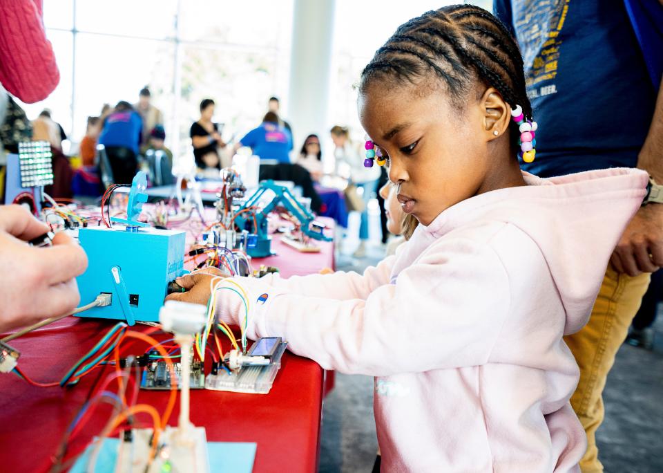 5-year-old Taylauni Shine does hands-on activities at a Girls & STEM event at Discovery World. The science museum will be hosting summer day camps, all of which include hands-on learning.