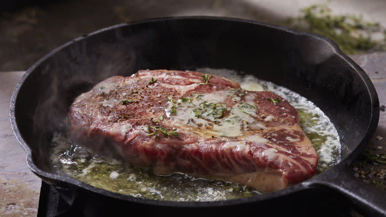 steak basting in pan