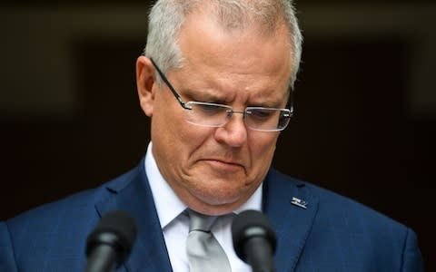 Scott Morrison said his government wants to reduce emissions - Credit: LUKAS COCH/REX