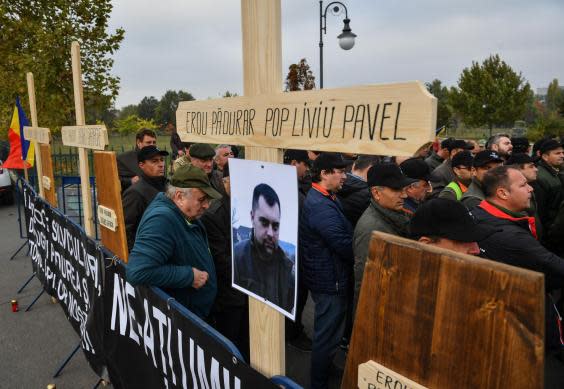 Colleagues of Liviu Pop (pictured) pay tribute after he was shot dead in northern Romania (AFP via Getty Images)