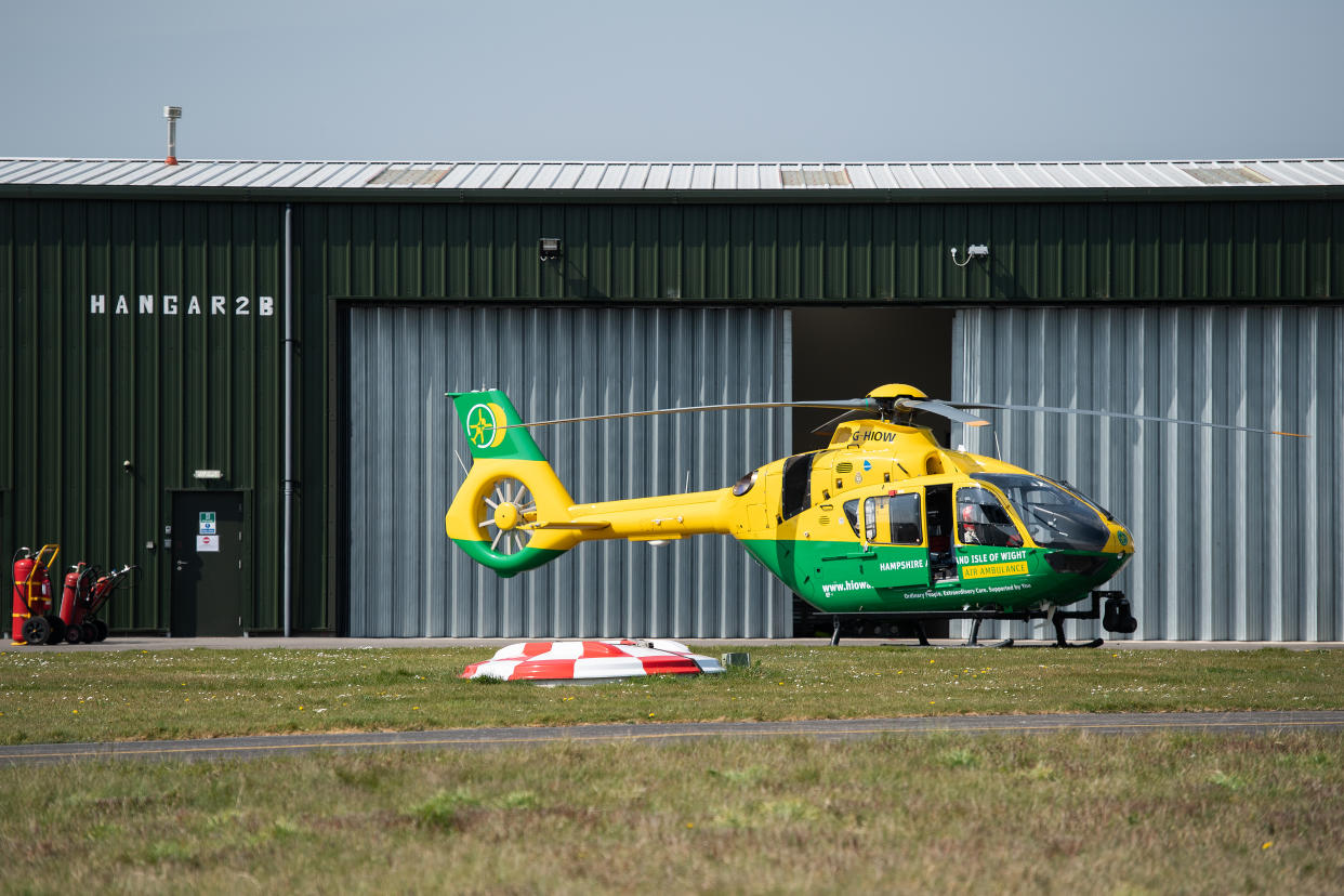 ANDOVER, ENGLAND - APRIL 09:  The Hampshire and Isle of Wight air ambulance helicopter is seen at Thruxton Aerodrome as members of the UK Armed Forces work with NHS medical staff and Air Ambulance Service crews on April 09, 2020 in Andover, England. The training session was arranged to ensure that the frontline medical staff could integrate successfully with military aircraft as and when needed during the ongoing global pandemic. There have been over 60,000 reported cases of the COVID-19 coronavirus in the United Kingdom and 8,000 deaths. The country is in its third week of lockdown measures aimed at slowing the spread of the virus.  (Photo by Leon Neal/Getty Images)