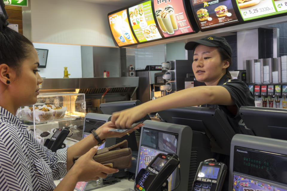 Woman serves man at McDonald's