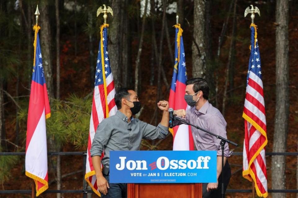 Latino voter registration event in LilburnDemocratic U.S. Senate candidate Jon Ossoff bumps elbows with former U.S. Housing and Urban Development Secretary Julian Castro during a Latino voter registration event in Lilburn, Georgia, U.S. December 7, 2020.